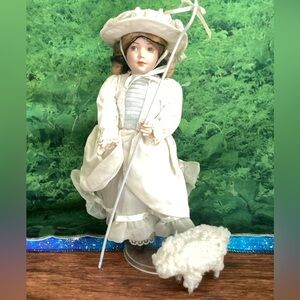 Elegant White Porcelain Doll with Hat
